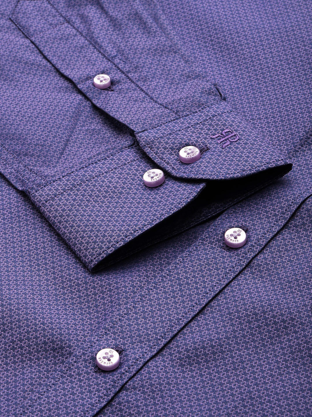Close-up of a purple shirt with buttons and collar details