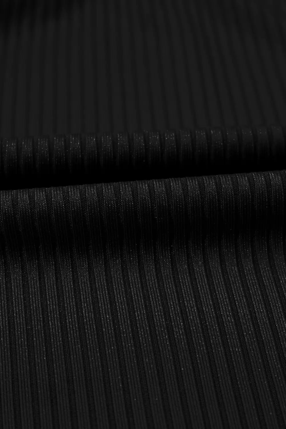 Close-up of black ribbed fabric texture