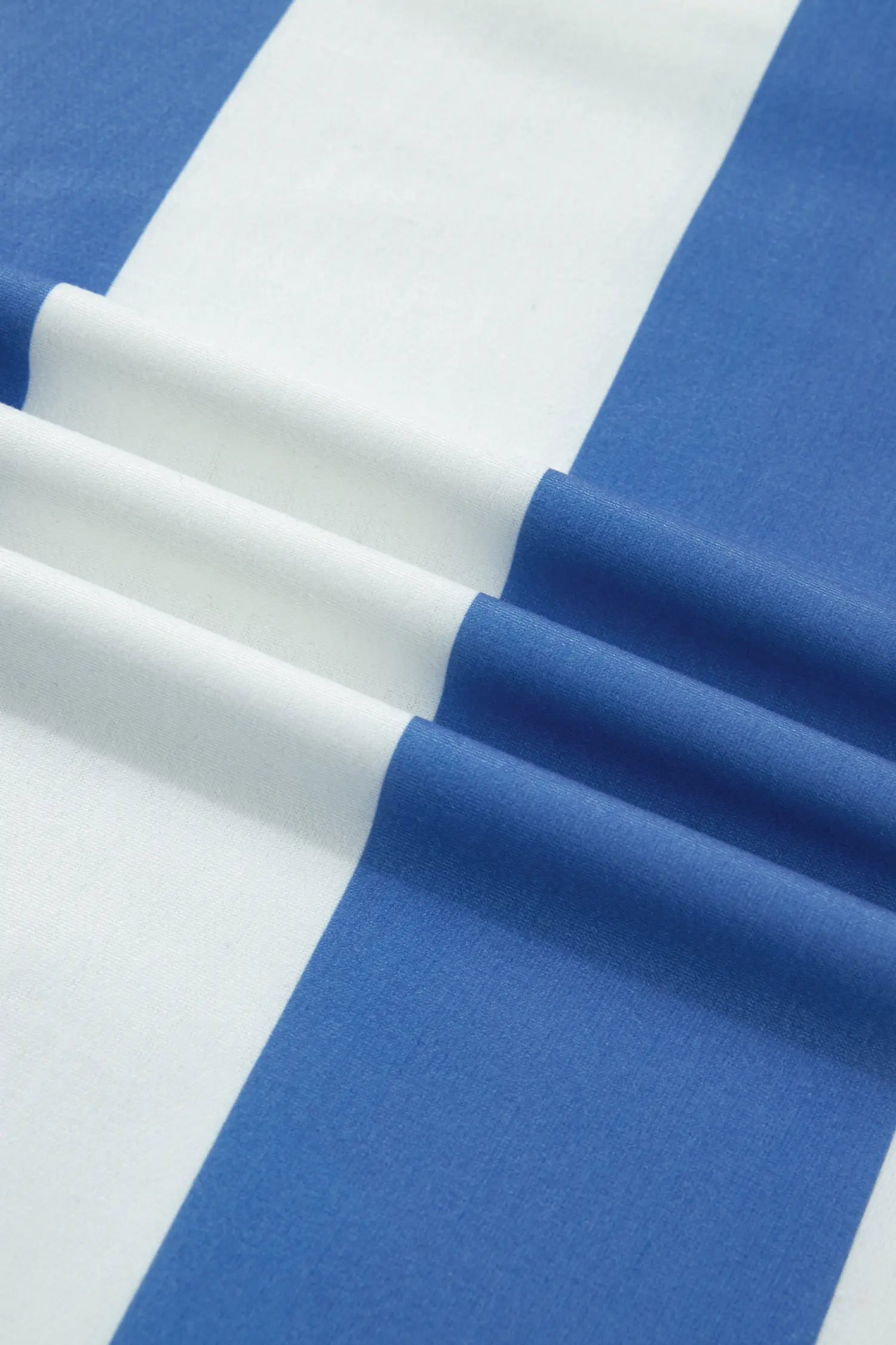 Close-up of blue and white fabric with a striped pattern