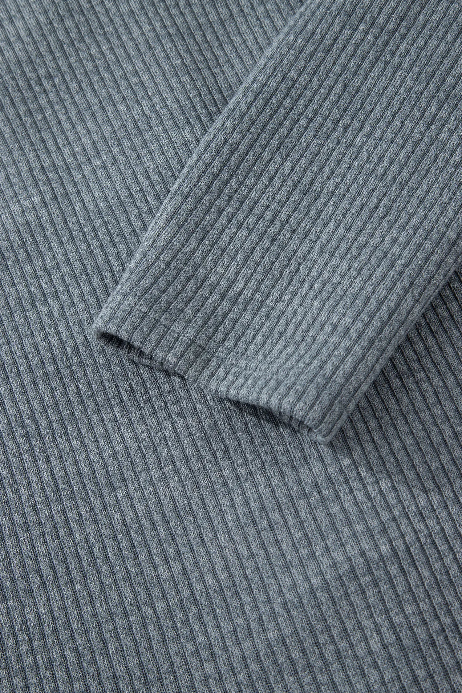 Close-up of ribbed fabric with a focus on texture and pattern.