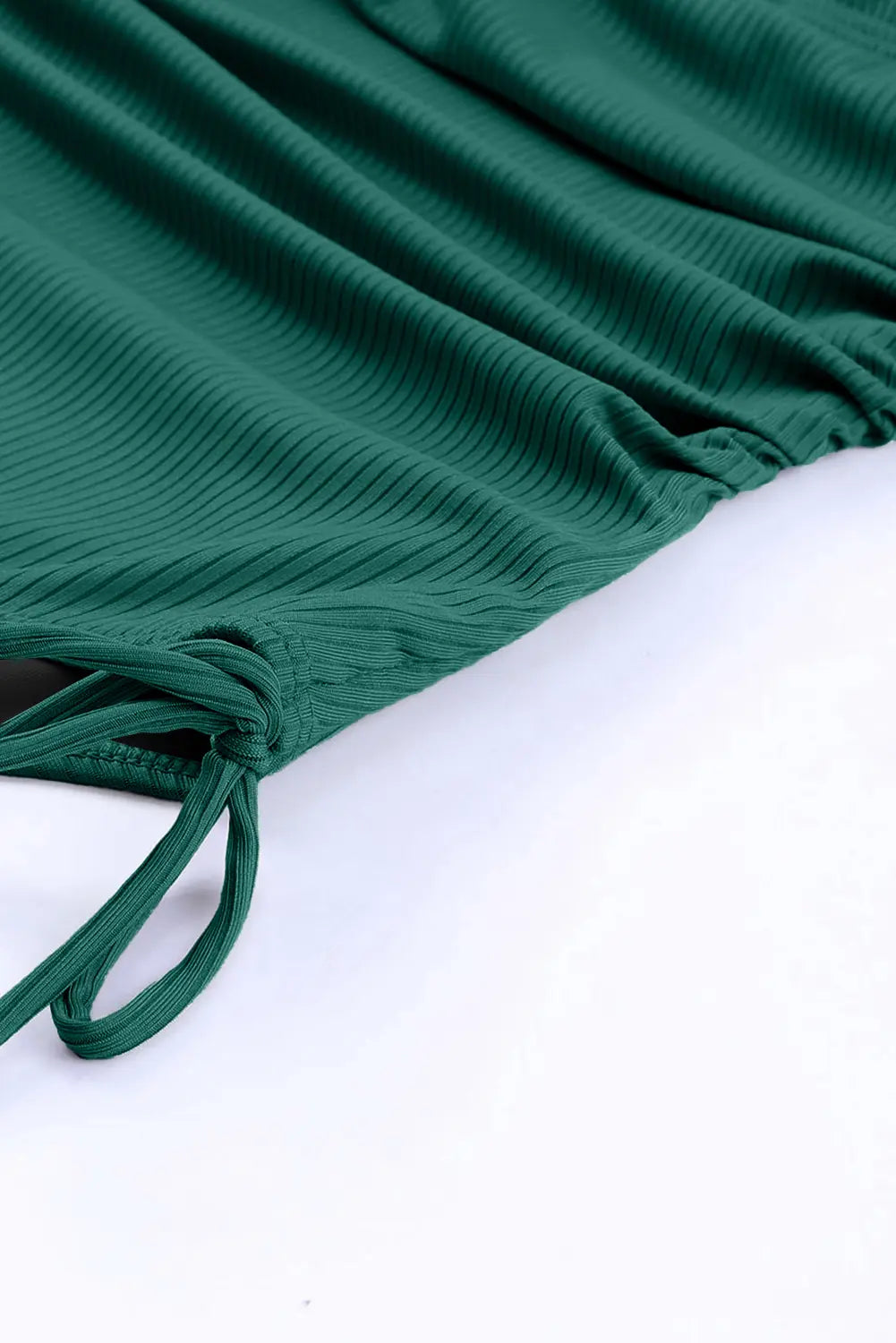 Close-up of green fabric with a white background