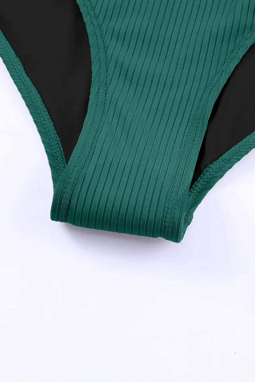 Green ribbed swimsuit top on a white background