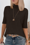 Close-up of cream textured cardigan with ribbed knit placket & gray snap on sherpa background.