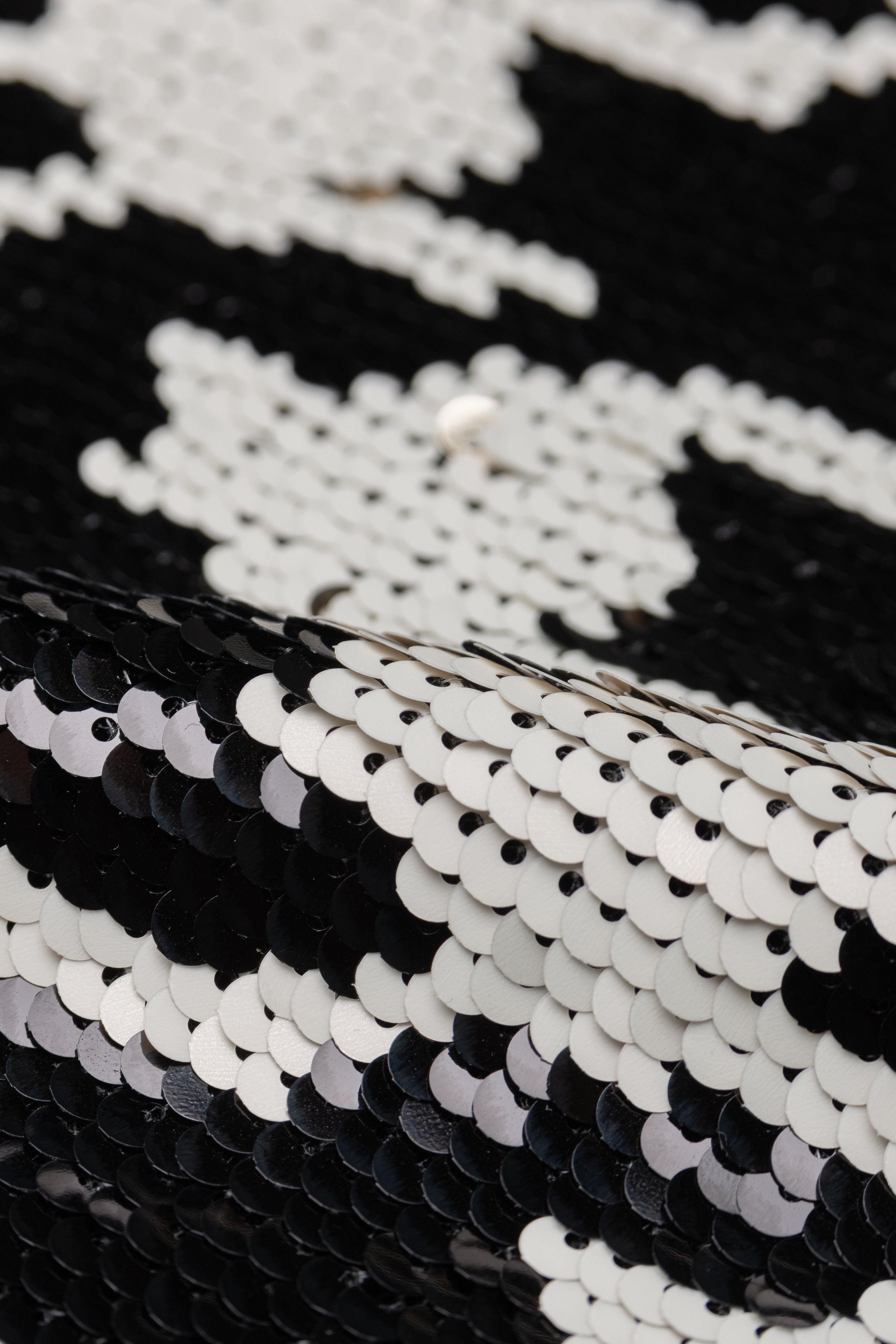 Close-up of black and white sequin fabric