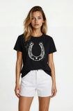 Woman wearing a black t-shirt with a horseshoe design on a white background