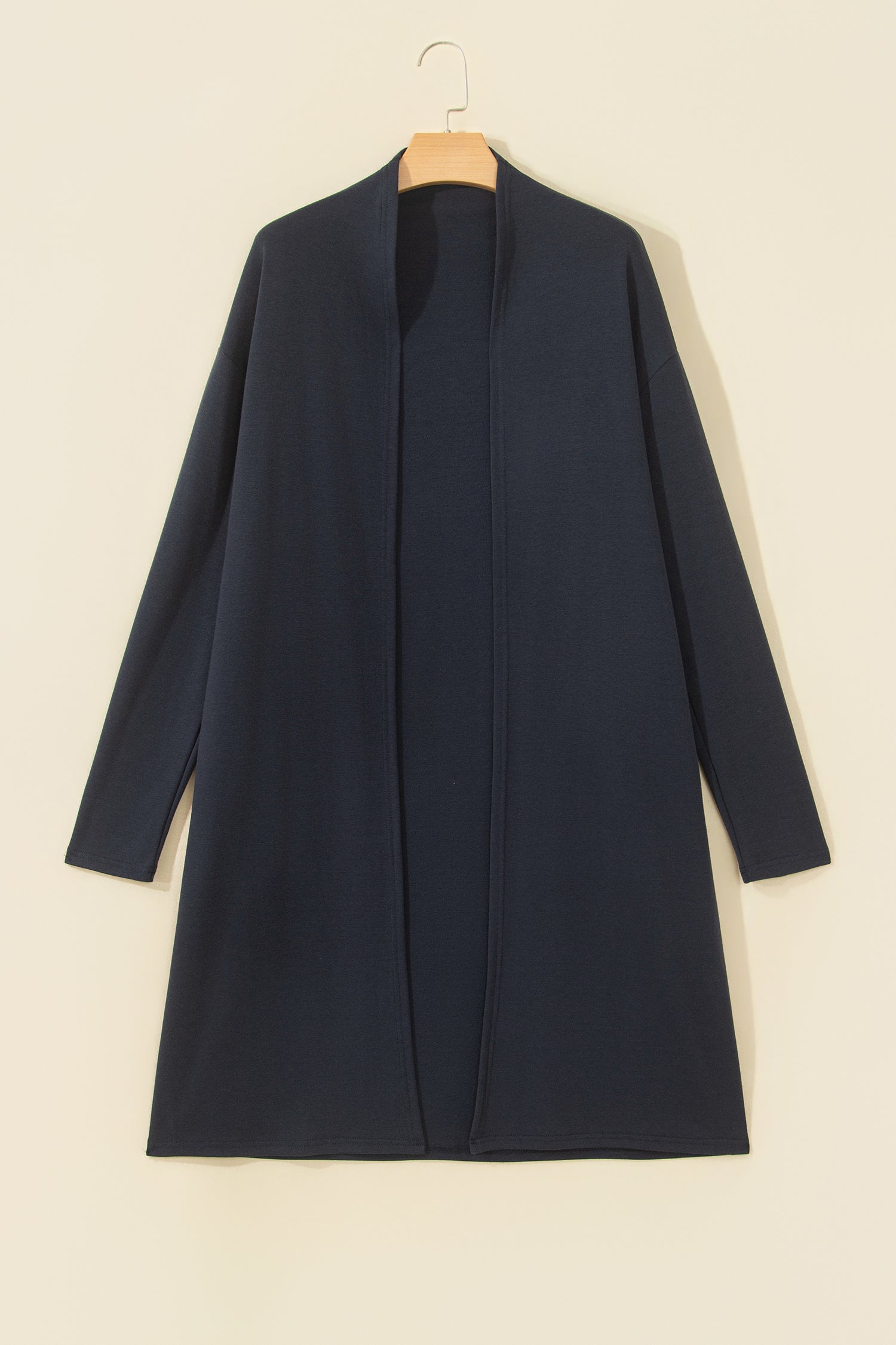 A dark navy blue open-front cardigan or long coat with long sleeves