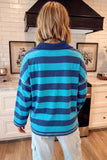 Back view of person in blue-turquoise striped long-sleeve shirt.