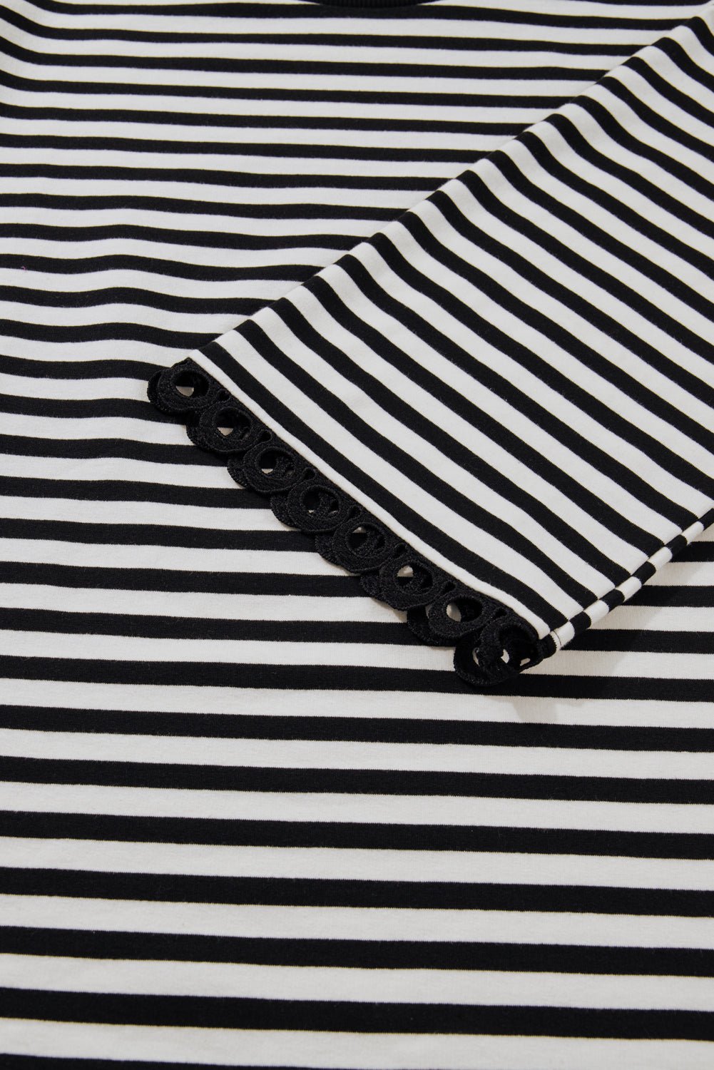 Black and white striped fabric with a pocket detail