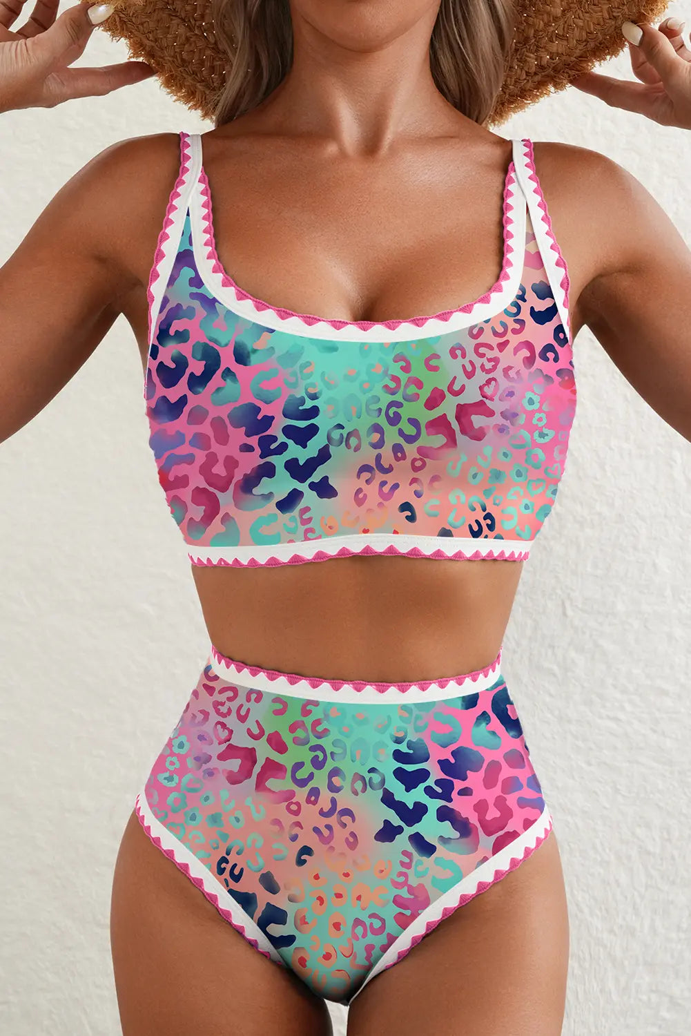 Multicolored leopard print bikini set on a plain background