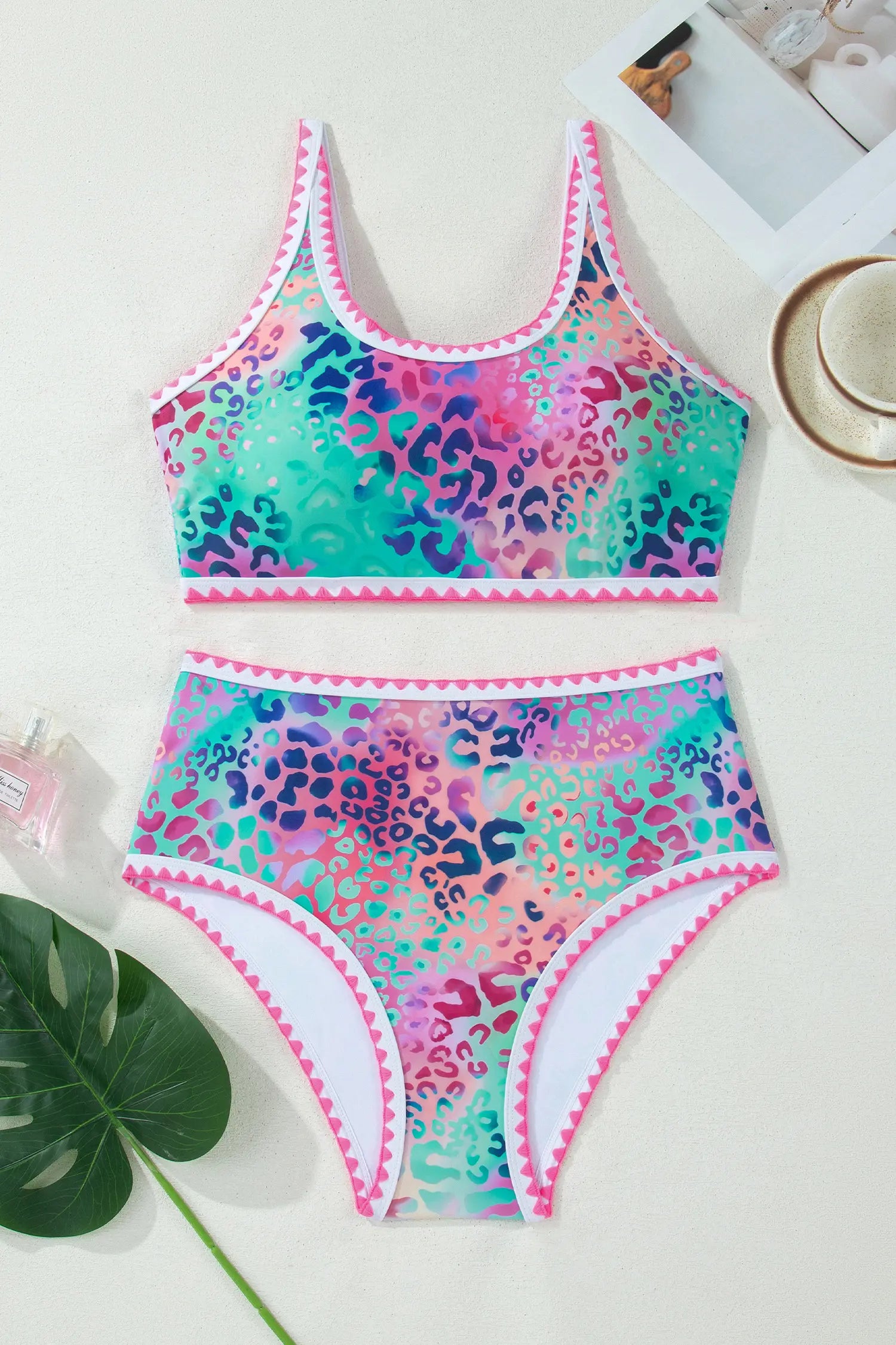 Colorful leopard print swimsuit on a light background