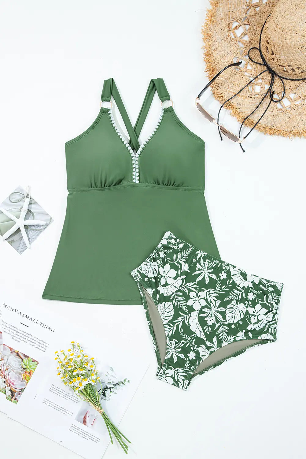 Green swimsuit with floral patterned bottom on a white background