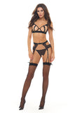 Woman wearing a black lingerie set with stockings on a white background