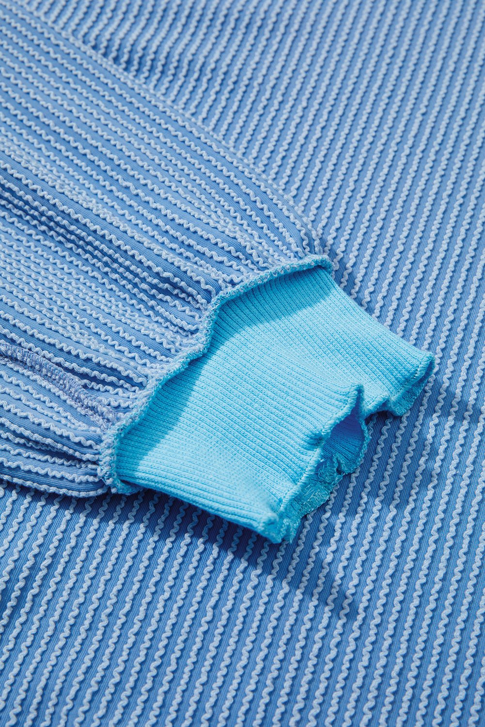 Close-up of blue fabric with a textured pattern