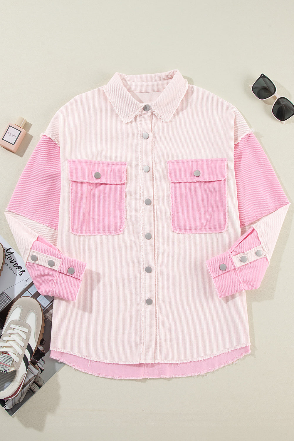 Pink and white denim jacket on a light gray background