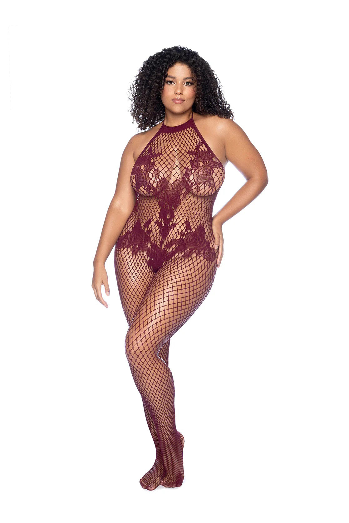 Model wearing a burgundy lace bodysuit with fishnet stockings on a white background