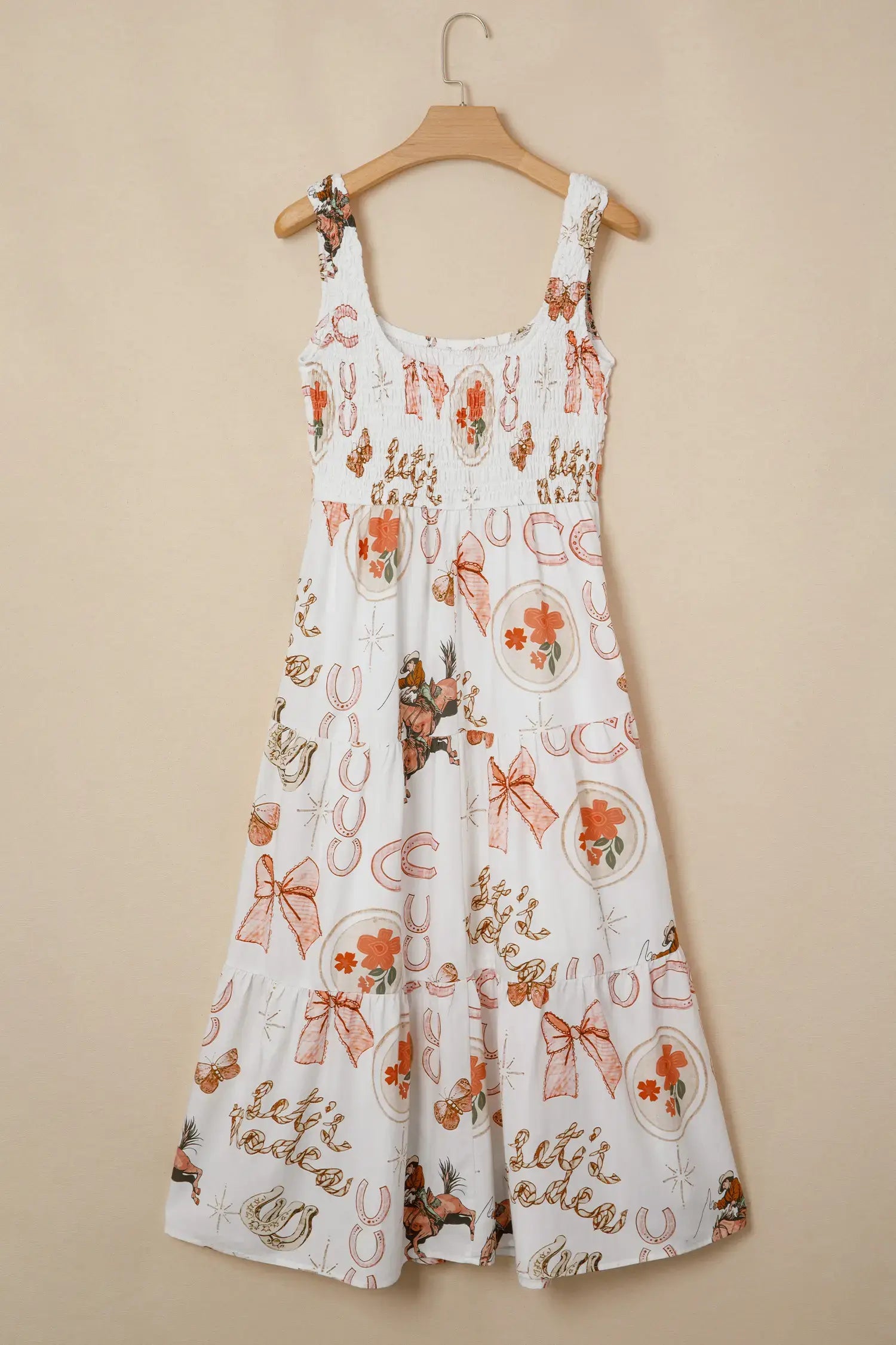 White dress with floral and ribbon pattern on a beige background