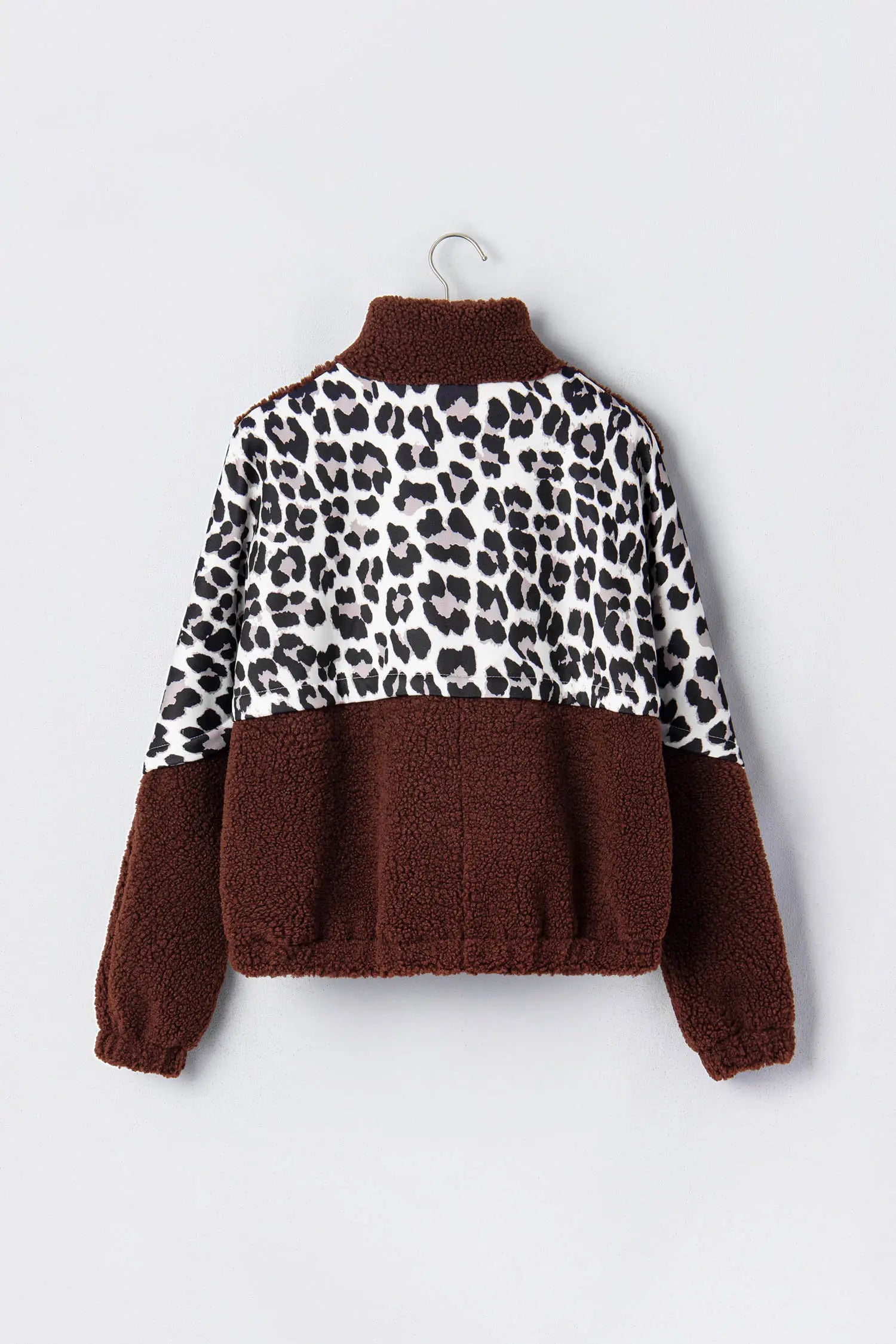 Kids’ brown teddy fleece jacket with white leopard-print panel and brown collar.
