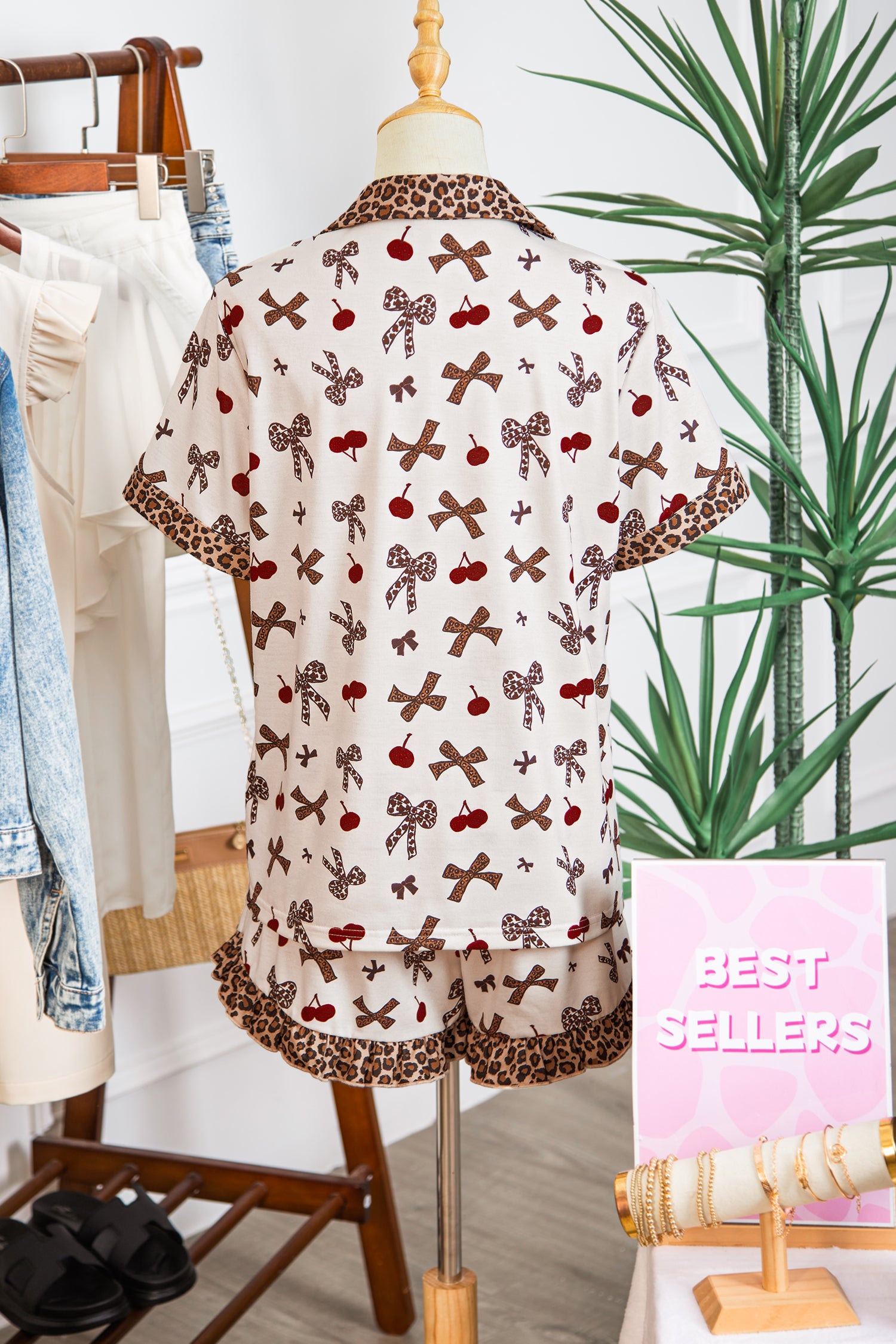 Patterned blouse on a mannequin with a 'Best Sellers' sign in the background