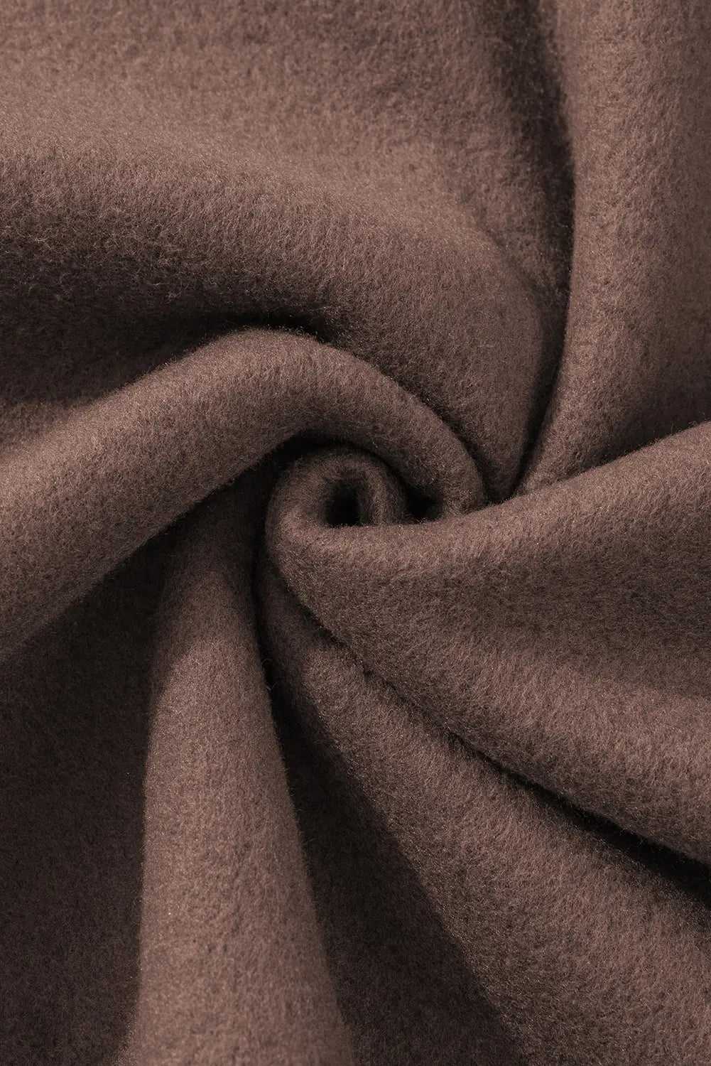Close-up of brown fabric with folds