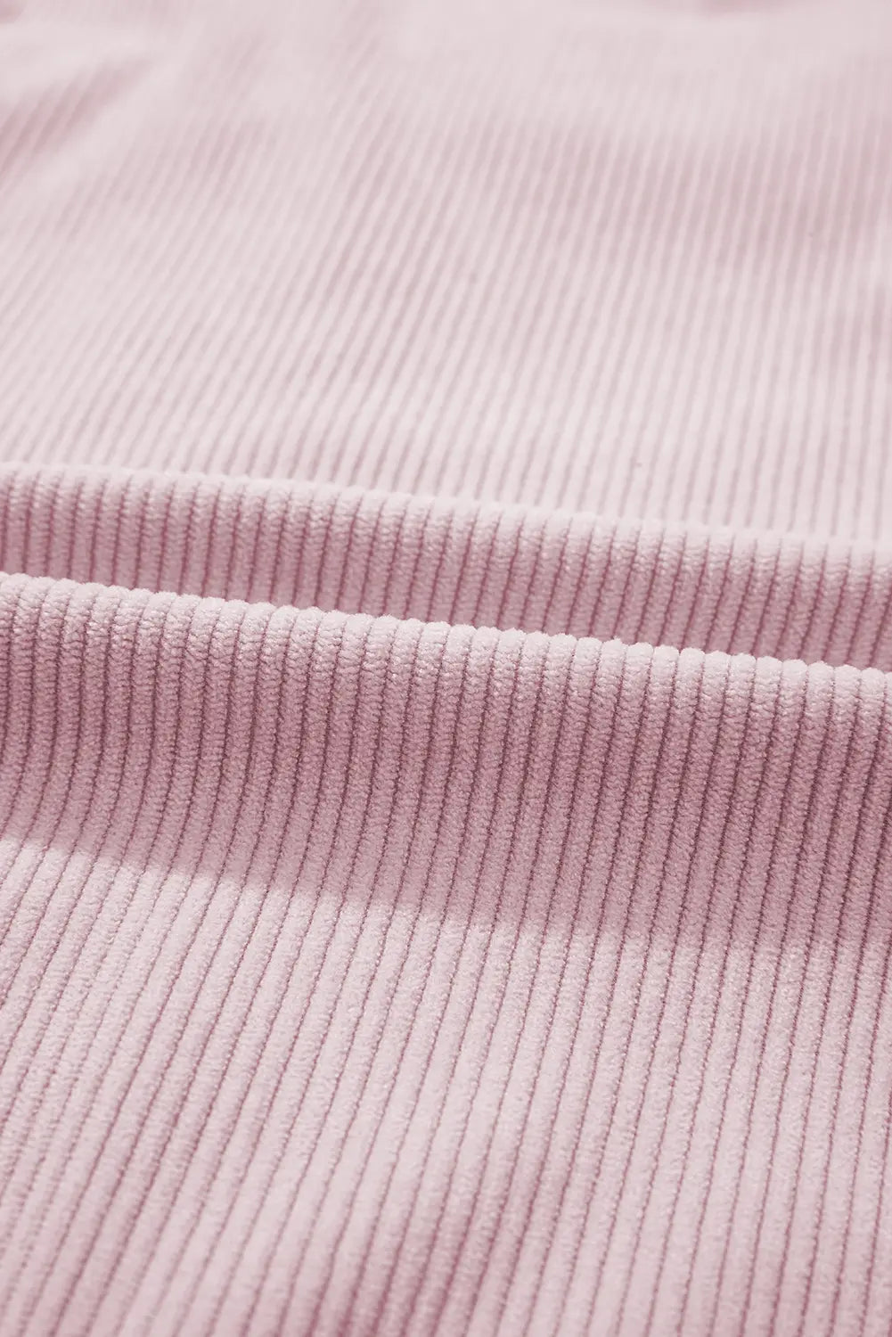 Close-up of pink ribbed fabric texture