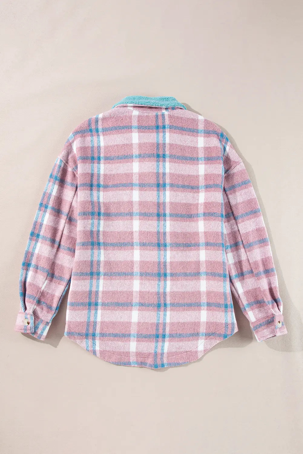 A pink and white plaid flannel shirt with light blue stripes, shown from the back on a neutral beige background.