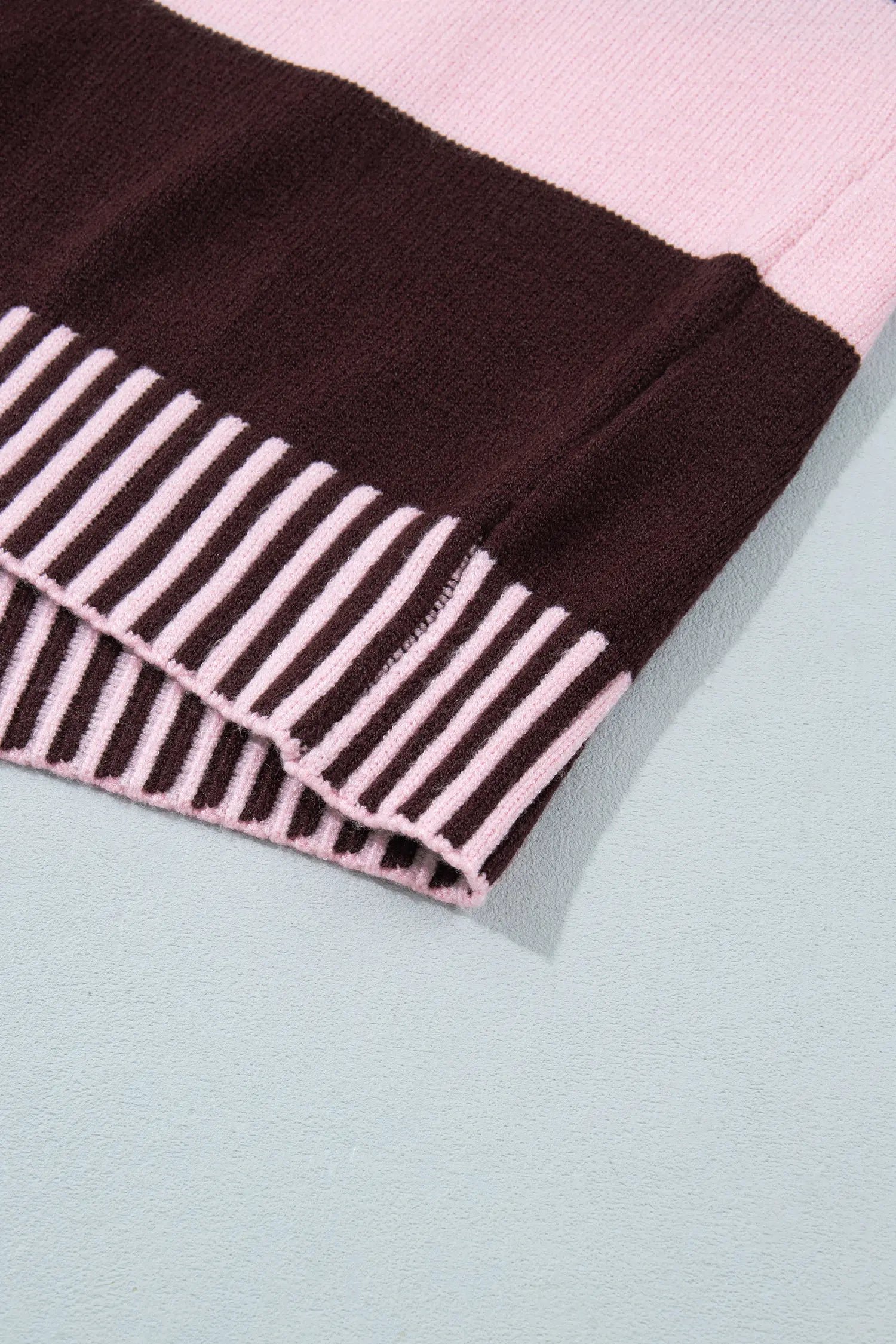 Close-up of a knit garment corner showing a dark brown solid section, a light pink solid section, and a pink-and-brown striped ribbed cuff on a pale blue background.
