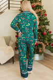 Back view of woman in colorful candy cane Christmas pajamas beside decorated tree.