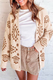 Woman in cream cardigan with brown geometric patterns, white tee, and tan corduroy shorts.