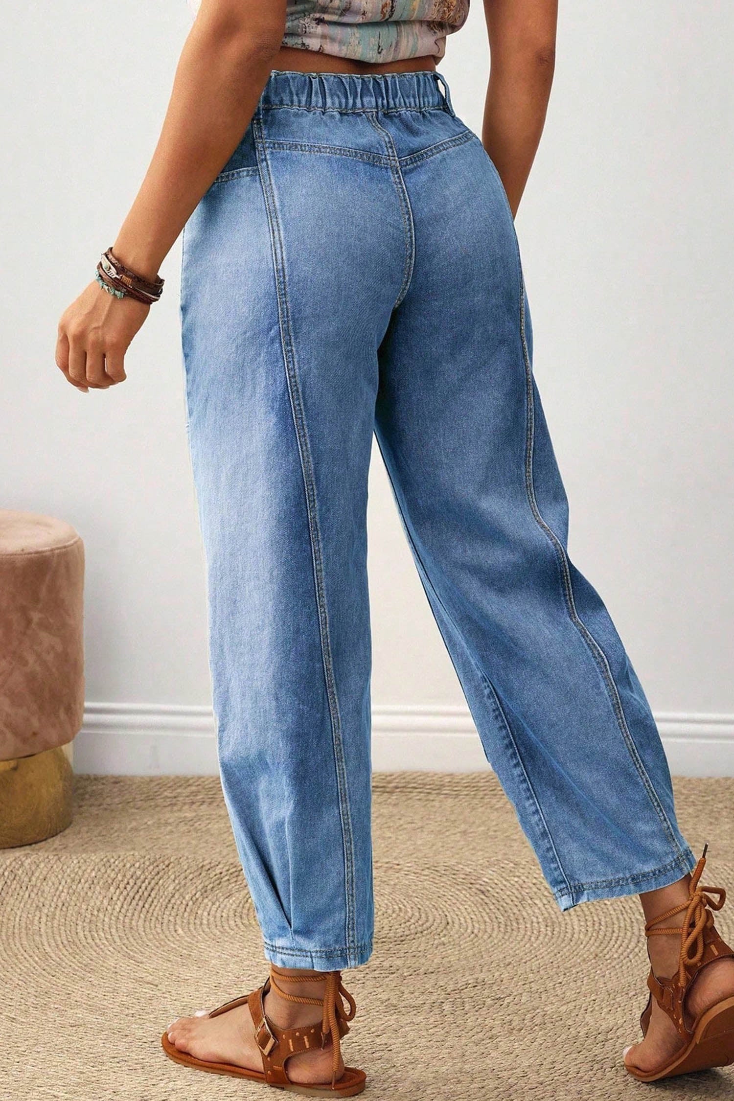 Back view of beau blue barrel leg jeans with elastic back waistband