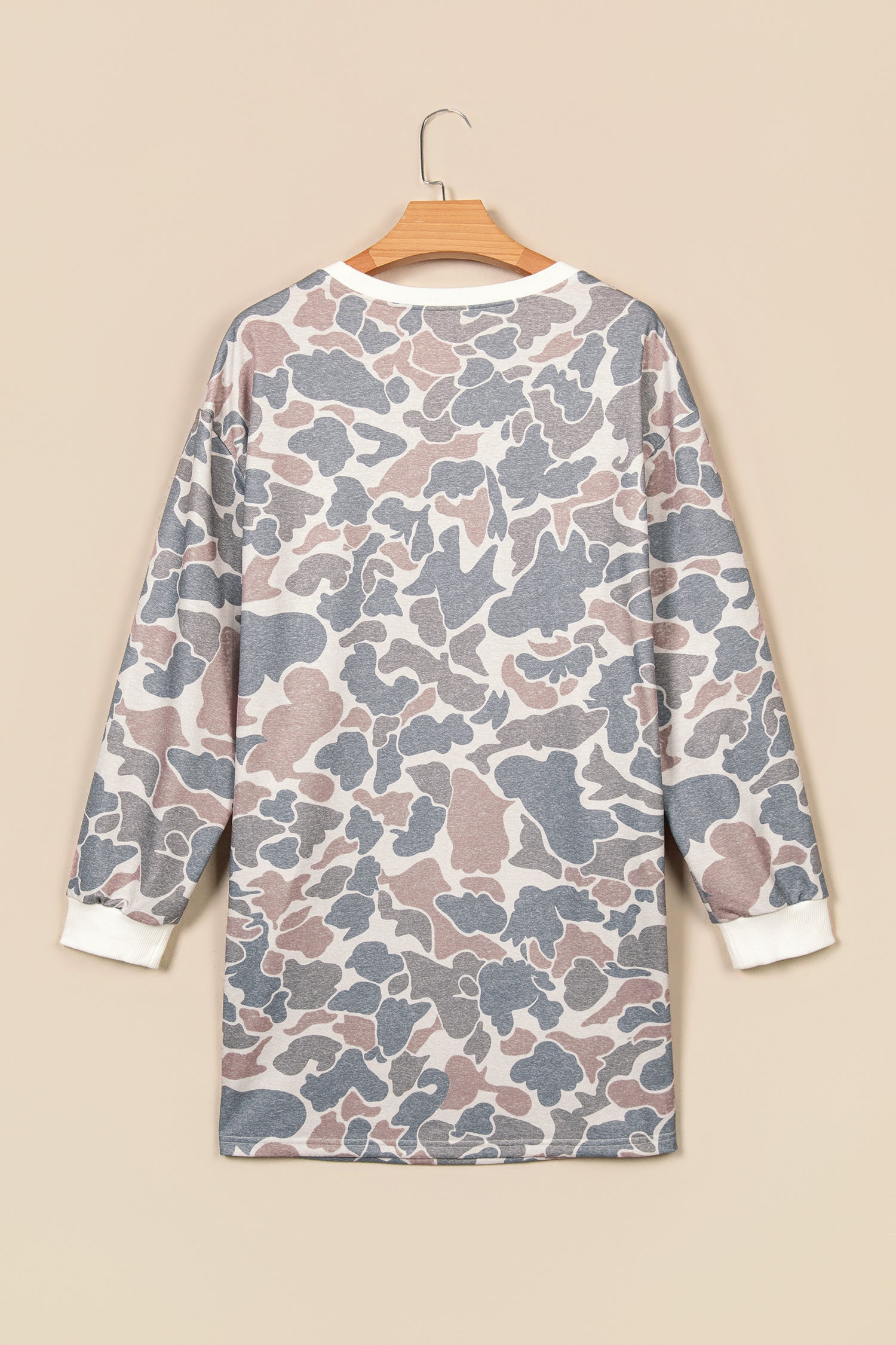 Beige camo print mini dress on a hanger, back view