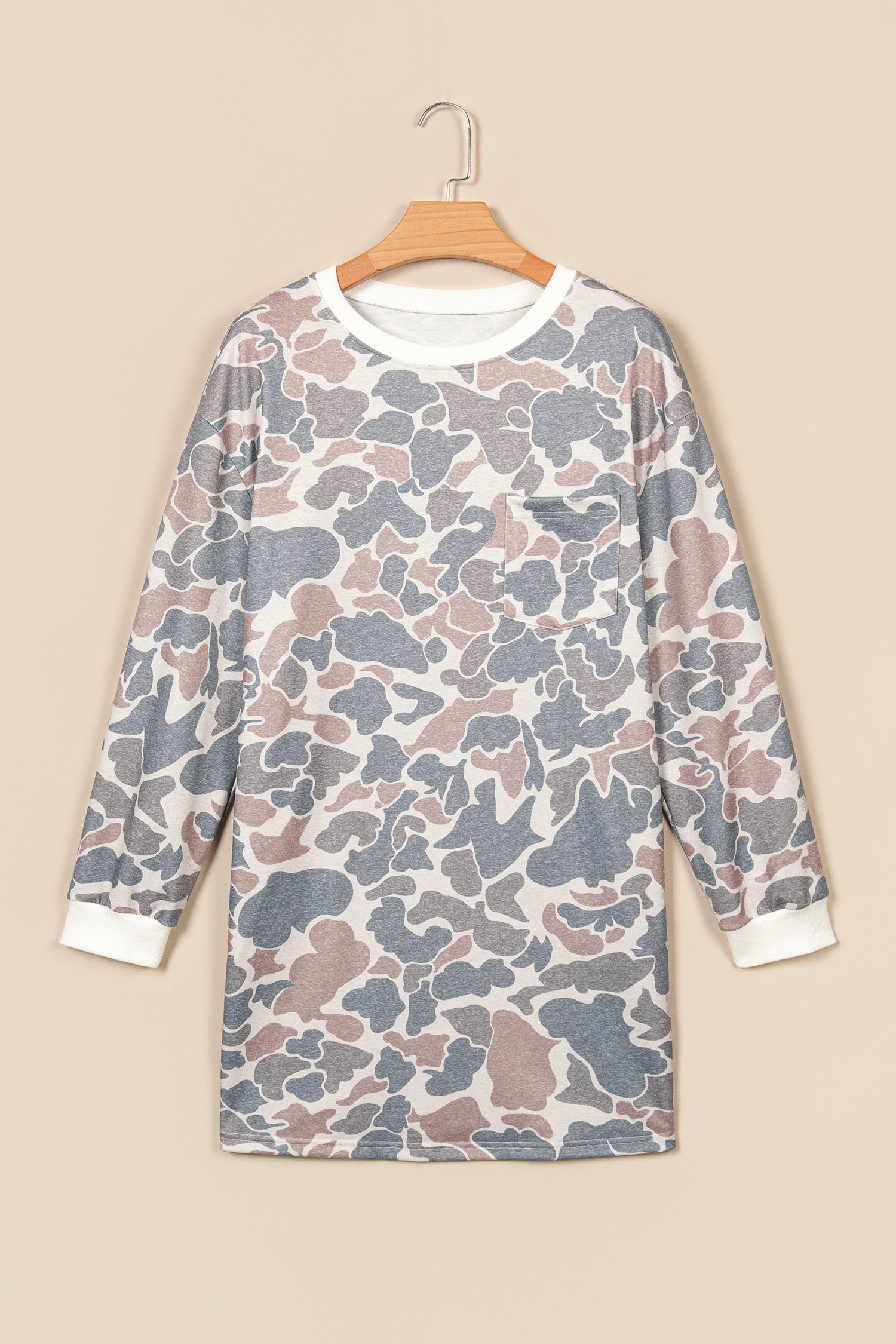 Beige camo print mini dress with white ribbed trim on a hanger, front view