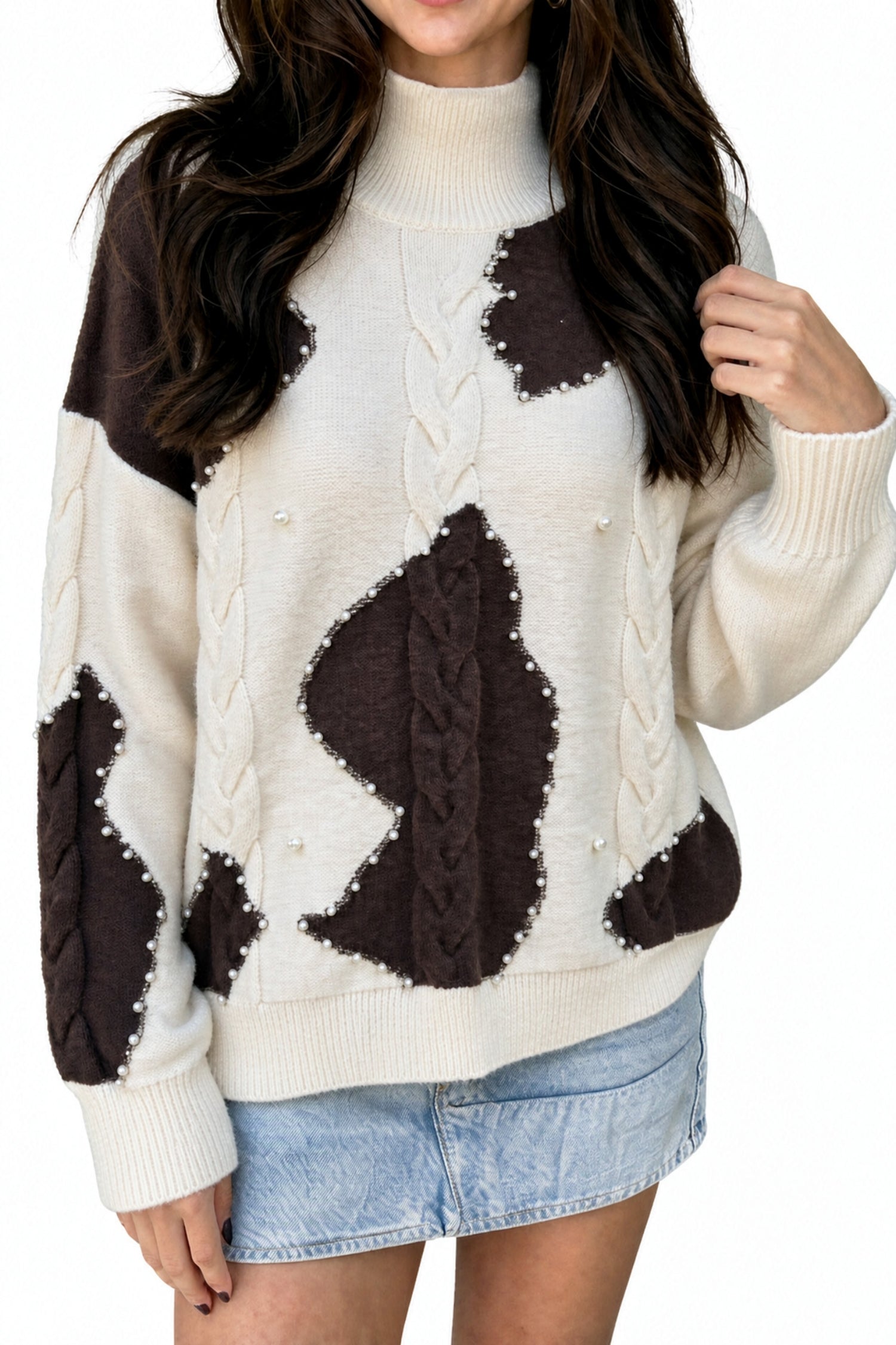 Beige and brown cow print beaded cable knit mock neck sweater, front view