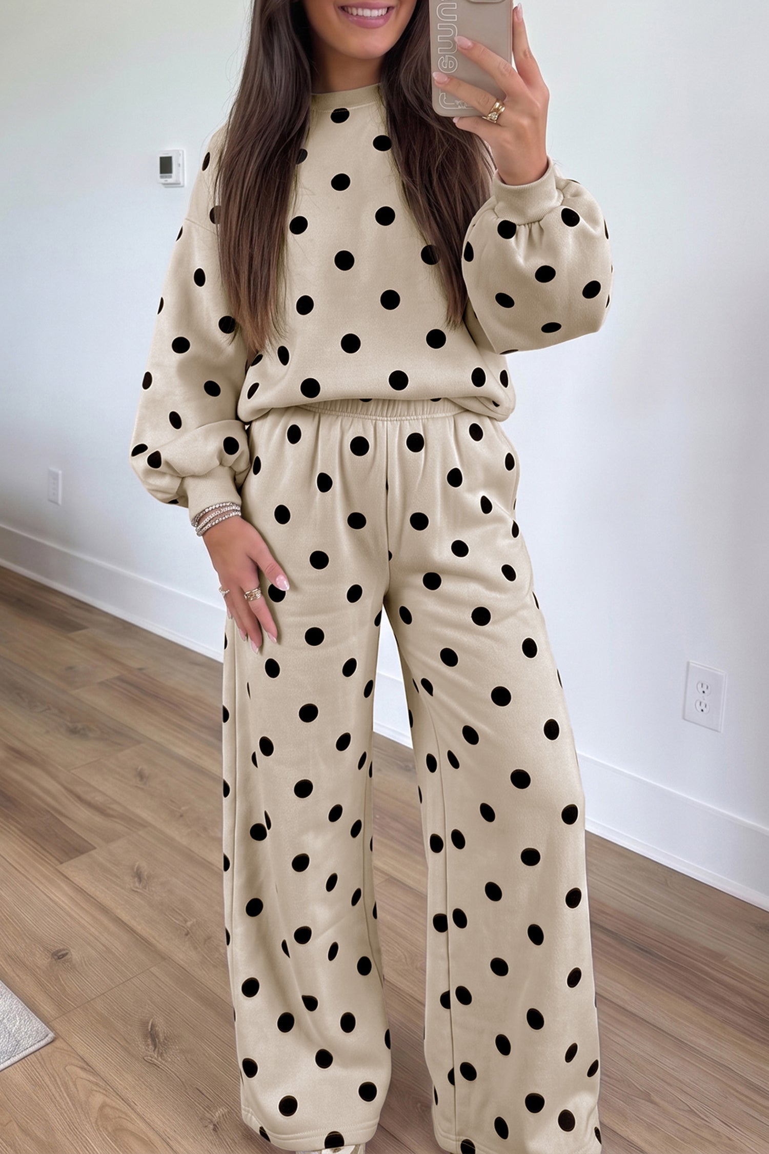 Beige sweatshirt and pants set with black polka dots and ribbed puff sleeves, front view