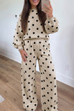 Beige sweatshirt and pants set with black polka dots and ribbed puff sleeves, front view