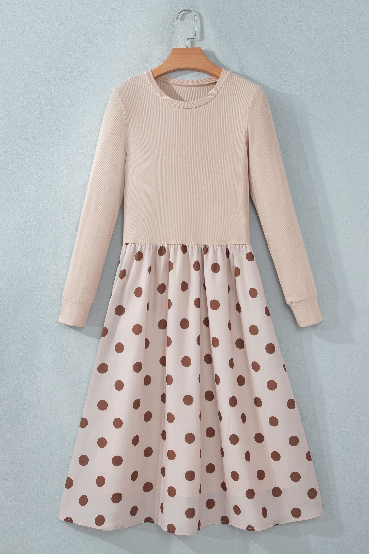 Beige ribbed knit polka dot midi dress on a hanger, front view