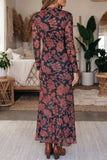Back view of black and red floral mesh maxi dress with flared hem