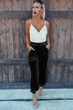 Black velvet jogger pants styled with a white lace cami and heels