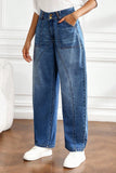 Side view of blue barrel leg jeans with curved seam detail