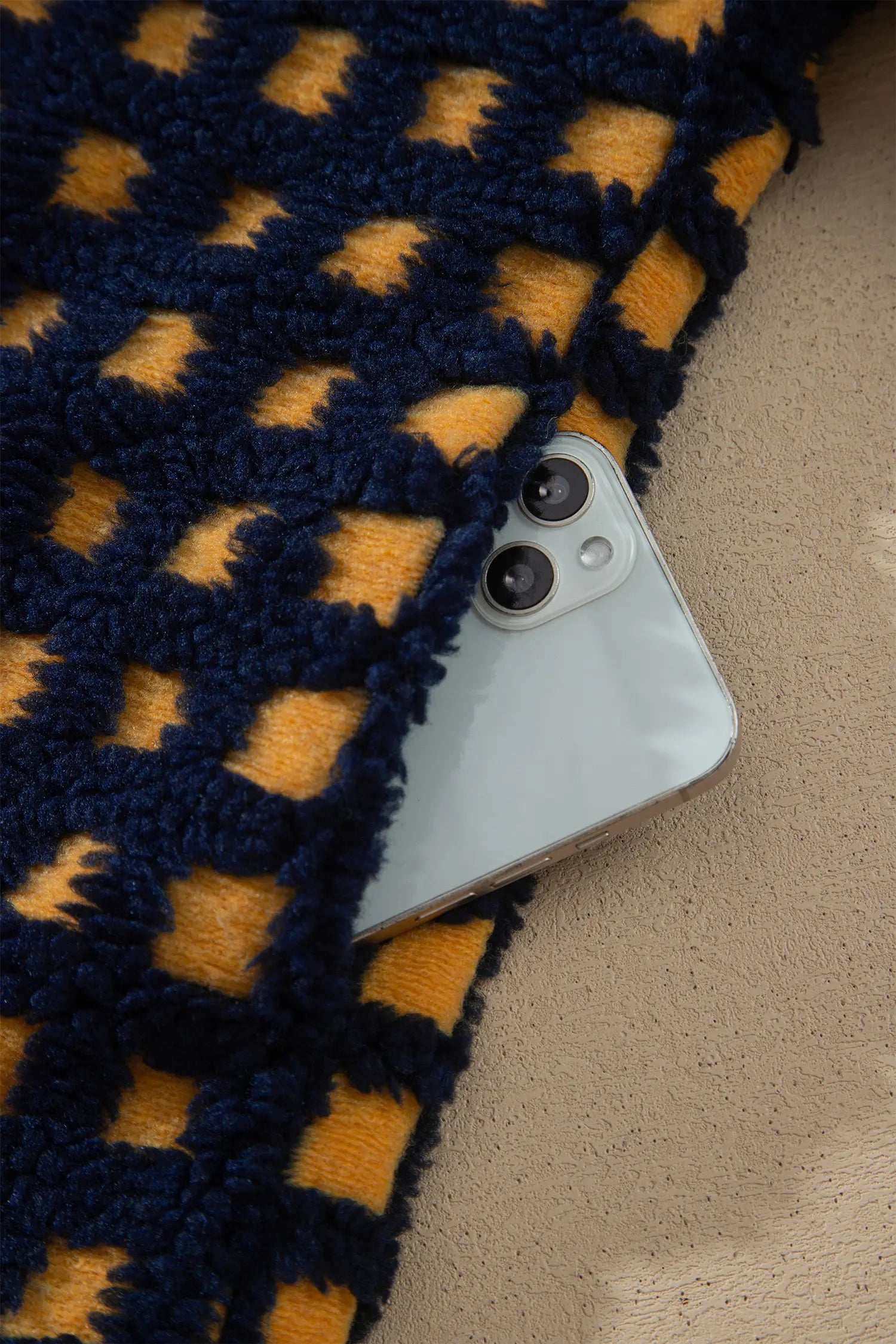 Navy and mustard check sherpa fleece jacket detail with phone for scale