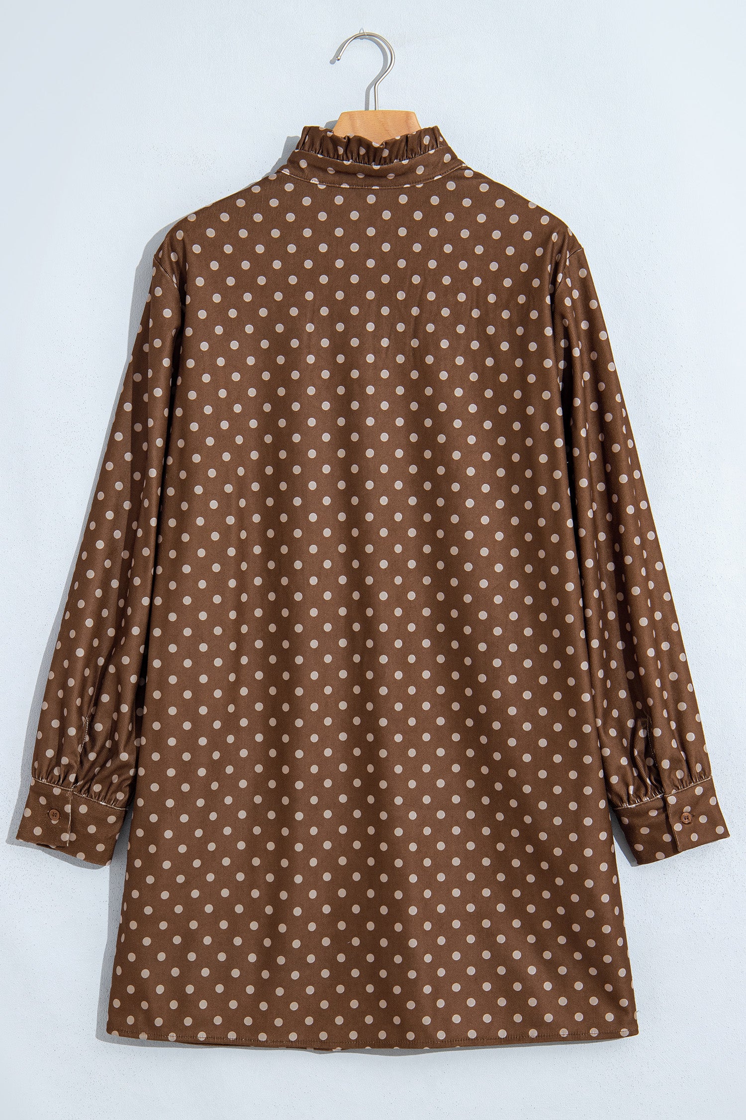 Back view of brown polka dot long sleeve shift dress with ruffle collar