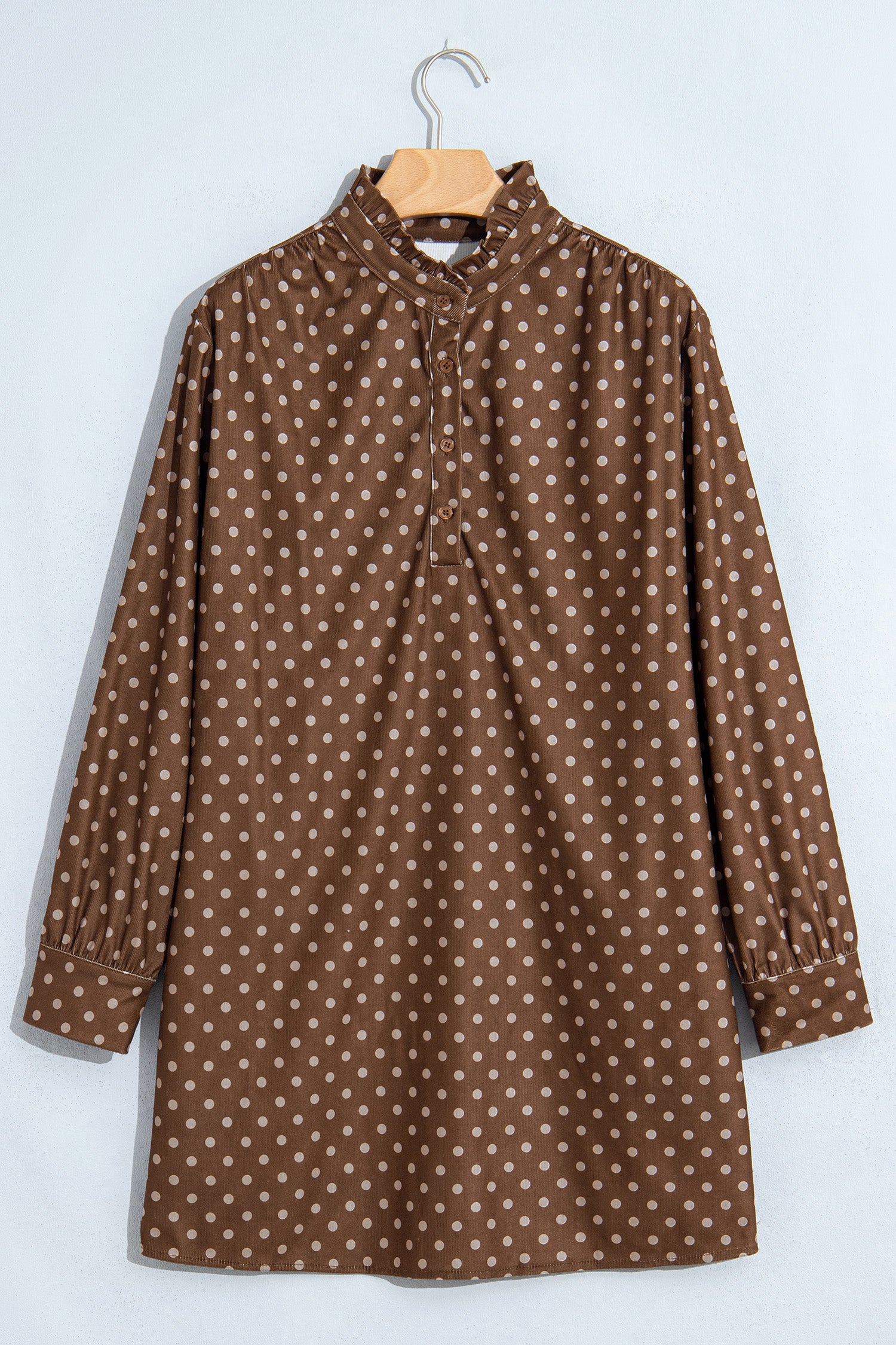 Brown polka dot shift dress with ruffle stand collar and button placket, front flat view