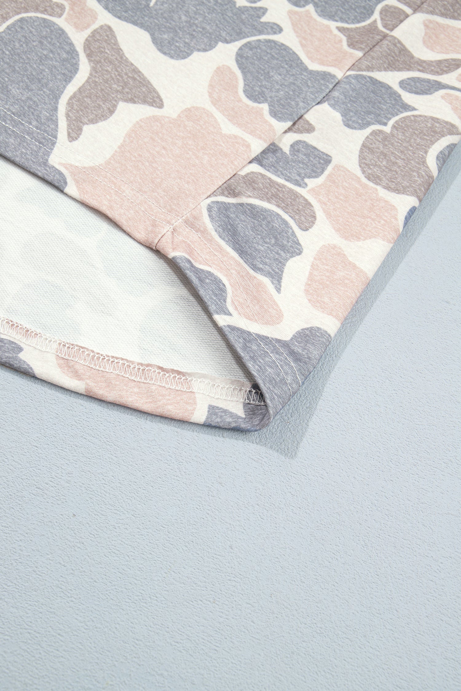 Pink camo shacket curved hem and inner seam detail