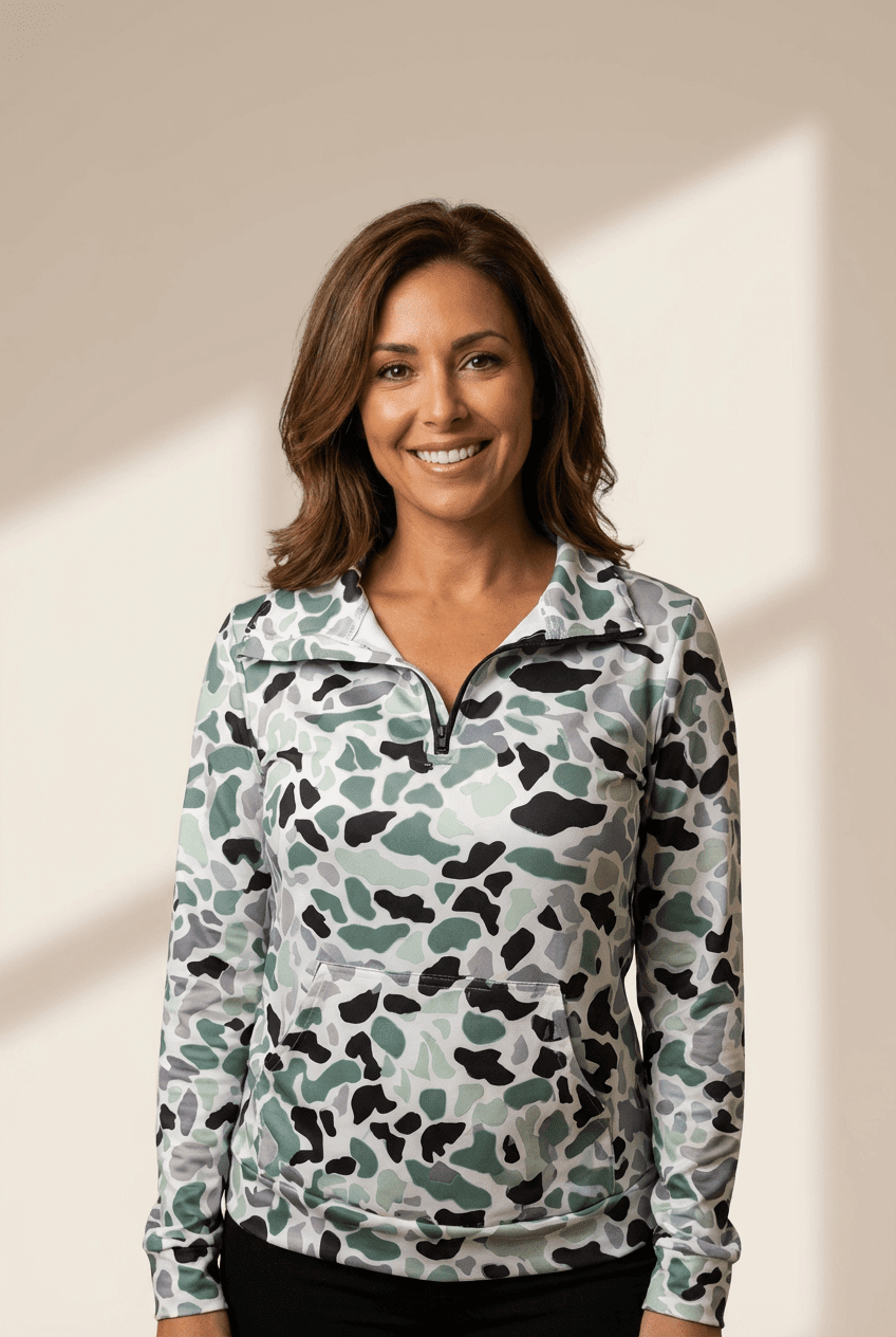 Woman wearing a patterned pullover against a neutral background