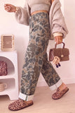 Camo print straight leg jeans with silver studs along the side seam, walking view