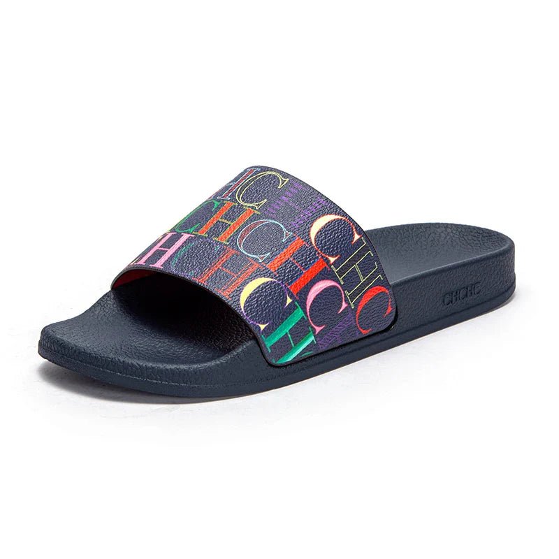 Black slide sandal with colorful logo pattern on a white background