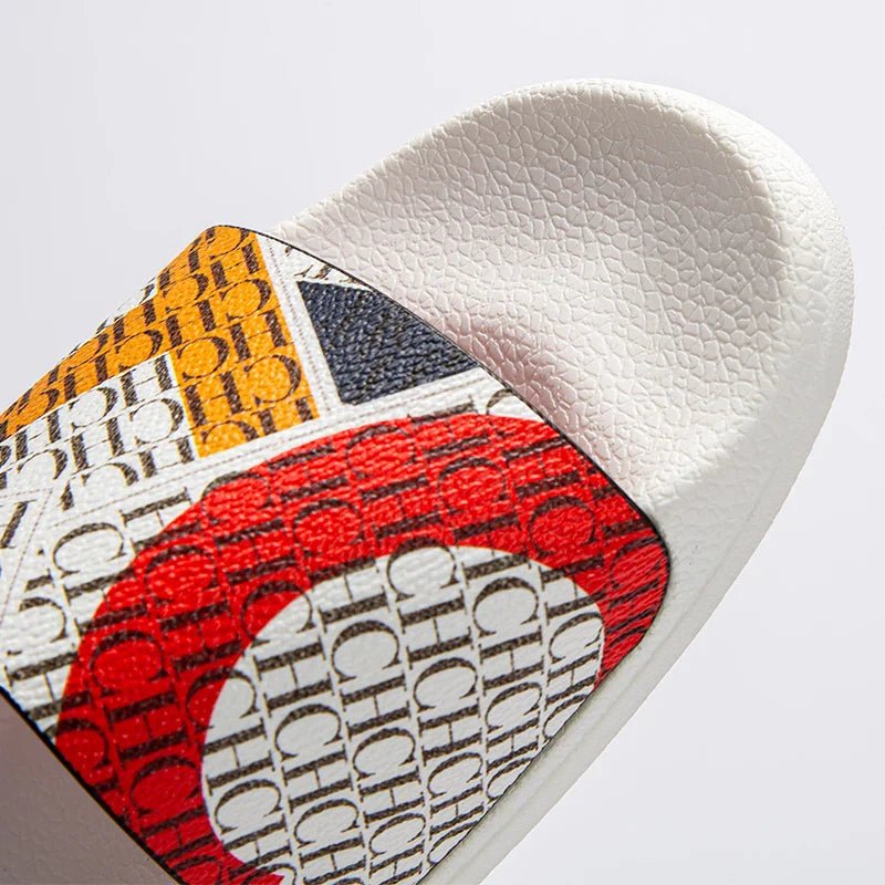 White slide sandal with colorful design on a white background