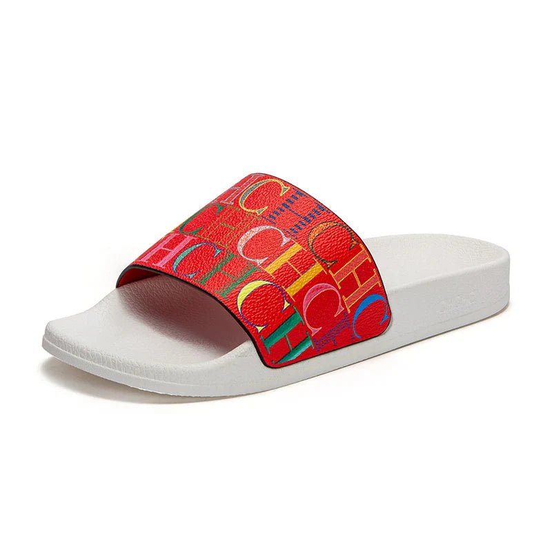 White slide sandal with a colorful red strap on a white background