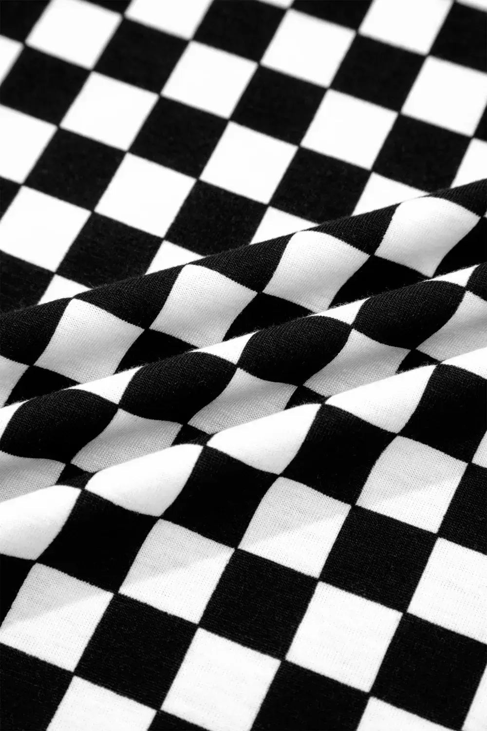 Close-up of black and white checkered fabric pattern