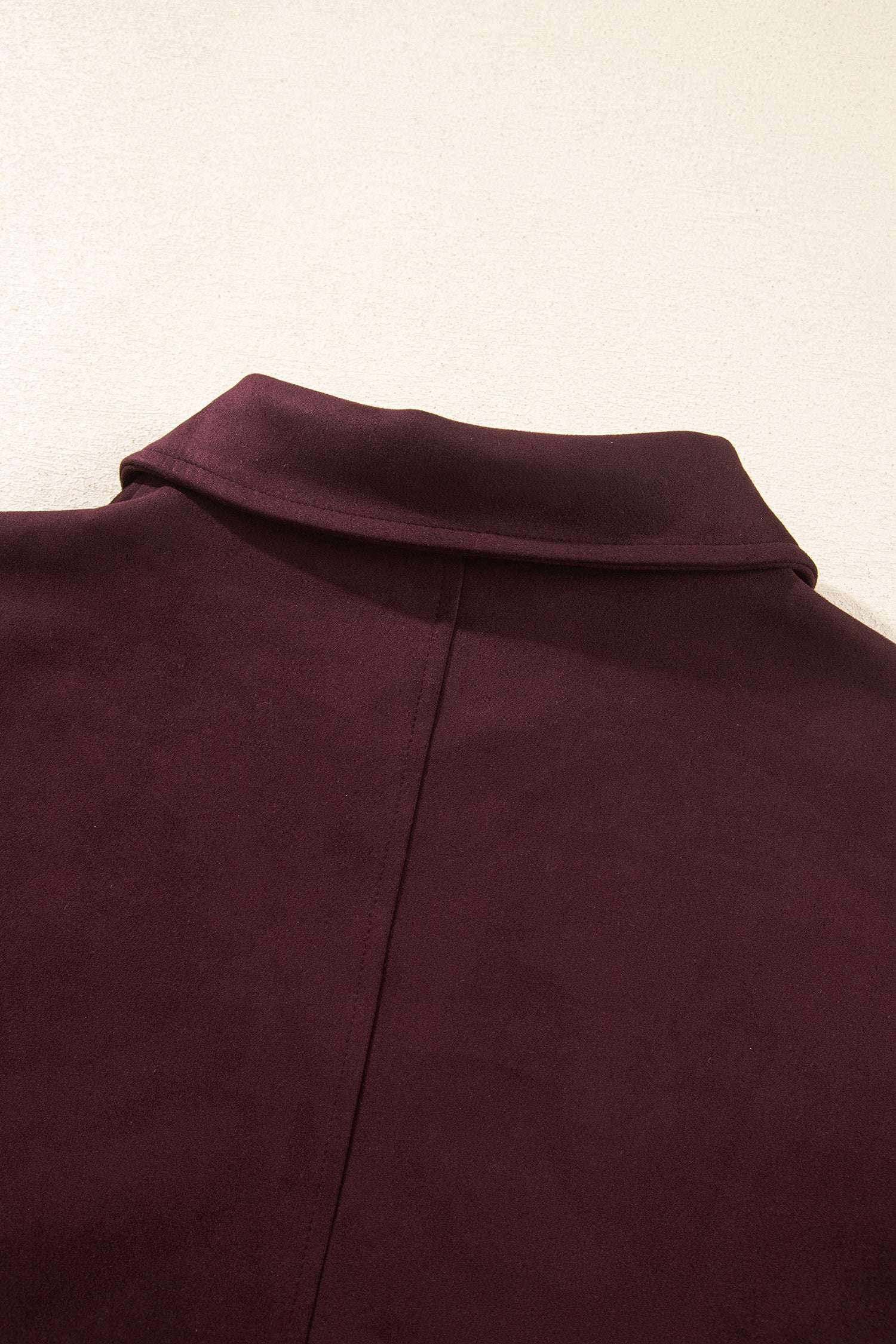 Close-up of collar and center back seam on chicory coffee suede look bomber jacket