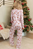 Back view of woman in long-sleeve pajamas with allover Christmas print.